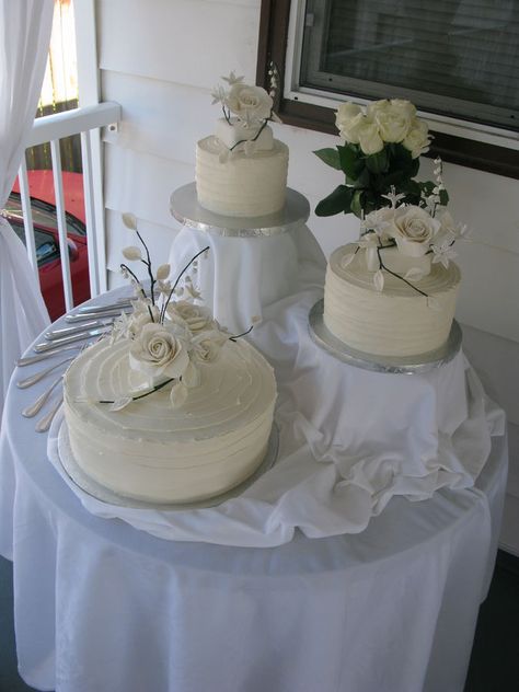 Three Wedding Cakes Display, Multiple Wedding Cakes Display, Multiple Wedding Cake Display Table, Multi Cake Wedding Display, Wedding Cake With Cookie Tiers, Stacking Wedding Cake Layers, Wedding Cake Display Table Candles, Multiple Wedding Cakes, Wedding Cake Setup