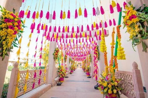 Photo of mehendi entrance decor idea with tassels and florals Mehendi Entrance Decor, Lehenga Photos, Indian Wedding Decoration, Mehendi Decor Ideas, Wedding Background Decoration, Wedding Entrance Decor, Door Hangings, Mandap Decor, India Wedding