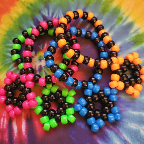 Bundle Of 4 Kandi Star Bracelets As Shown -Handmade By Me New No Tags -Made With Plastic Pony Beads And String -Kandi Stars Measure 1.83 In X 1.83 Inches -Bracelets Are 30 Beads Around There Are Also Matching Earrings Available In My Closet For Sale. Tags: Edc, Edm, Rave, Music Festival, Kandi, Plur, Kawaii, Music Festival, Electric Daisy, Coachella, Pride, Kandi Star Bracelets, Halloween, Cosplay, Y2k, Rave Gear, Retro, Kandi Trading, Kandi Bracelets, Punk, Neon, Vibrant, Gift, Dance, Techno, R Pride Kandi, Festival Kandi, Kandi Star, Kawaii Music, Scene Bracelets, Bracelets Halloween, Star Bracelets, Kandi Cuff Patterns, Diy Kandi Bracelets