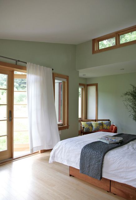 Peacefully designed bedroom with green walls Feng Shui Bedroom Layout, White Curtains Bedroom, Honey Oak Trim, Natural Wood Trim, Green Bedroom Walls, Light Green Walls, Feng Shui Bedroom, Oak Trim, Honey Oak