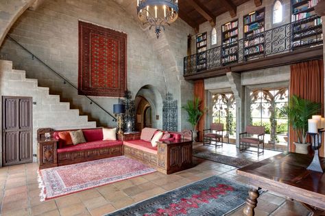 This Mediterranean-style home in Berkeley Hills, nicknamed "Hume Castle," is reminiscent of a 13th century French castle. It features gothic arches and medieval elements such as vaulted ceilings, spiral staircases, heavy wooden beams and stunning wrought-iron chandeliers. Medieval Apartment, Medieval Home, Modern Castle, Mediterranean Style Home, Famous Castles, French Castles, Wrought Iron Chandeliers, The Cloisters, Iron Chandeliers