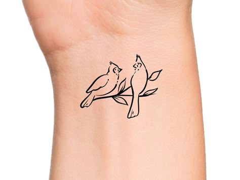 Small Cardinal Tattoo Black And White, 2 Cardinals Tattoo, Two Cardinals Tattoo, Cardinal Tattoo Small Simple Outline, Cardinal On Branch Tattoo, Two Cardinals Tattoo Black And White, Black And White Cardinal Tattoo, Cardinal With Flowers Tattoo, Minimal Cardinal Tattoo