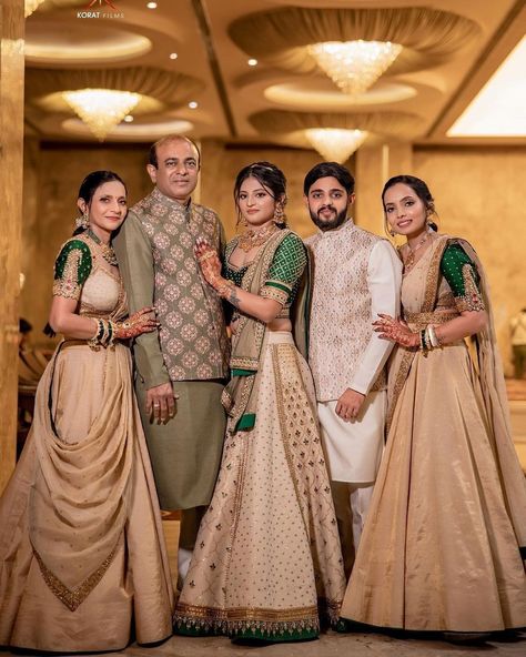 This family's color-coordinated outfit game is on point. 👌Agree? If you too planning for color-coordinated dress theme for wedding festivities then save this post for inspiration. 😍 Outfit: @jiviva_ HMUA: @sejal_savaliya22 & team Photography: @koratfilms #indianwedding #wishnwed #lehenga #lehengacholi #lehengalove #lehengas #lehengablousedesigns #lehengasaree #lehengainspiration #lehengagoals #lehengacollection #ehengadesigns #lehengastyle #lehengacholionline #designerlehenga Indian Bridal Family Outfits, Indian Family Wedding Outfits, Family Same Dress Indian Wedding, Family Outfits For Wedding Indian, Indian Wedding Family Outfits, Family Traditional Outfits Indian, Matching Family Outfits For Wedding, Family Photo Outfits Indian, Family Function Outfit