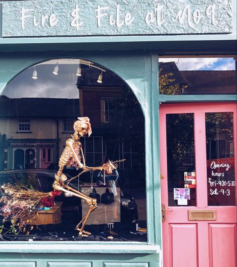 Halloween shop window display. Golden skeleton riding a broom wearing jewellery from Fire & File Metal Design Halloween Shop Window Display Ideas, Window Display Halloween, Halloween Window Display Retail, Halloween Shop Window Display, Halloween Store Window Display, Halloween Store Windows, Halloween Shop Window, Florist Window Display, Halloween Store Display