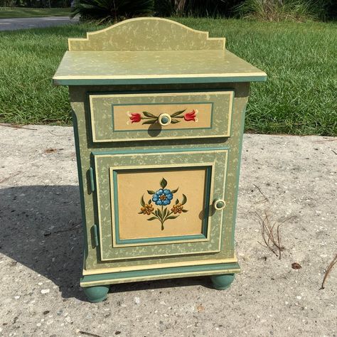 Tyrolean Region Austrian Folk Art Furniture. Armoire, chest of drawers, and nightstand. Original Floral paintings on a mixed green field dates this to the earliest times this furniture was produced in Austria. Crafted by painted by hands by Germans who fled across the Alps in an attempt to escape the war. All research shows this furniture is very limited in the United States. We are offering numerous pieces on Chairish please see our entire collection before its gone. Germanic Folk Art, Painted Drawers Ideas Aesthetic, Medieval Folk Art, Hand Painted Folk Art Furniture, Folk Art Furniture Painting Ideas, Hand Painted Chest Of Drawers, Folk Art Bedroom, Indian Painted Furniture, Rosemaled Furniture