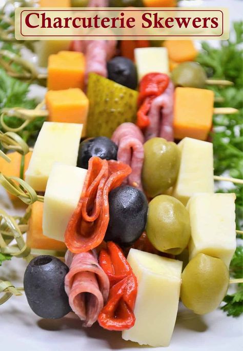 Charcuterie boards are all the rage and these Charcuterie skewers help you serve the meat and cheese your party guests will love with less hassle. Charcuterie on a stick is a fun twist that is simple to prepare and easy to serve and eat. They make a great stand alone appetizer yet pair perfectly with all of your favorite party appetizers. Perfect as a Thanksgiving appetizer, Christmas appetizer, for New Year's Eve or any gathering these appetizer skewers are sure to be a hit. #charcuterie Cheese Meat Skewers, Appetizer Snacks For Party Easy, New Years Party Appetizers Simple, Bowtie Charcuterie Skewers, Meat Cheese Olive Skewer, Cheese Toothpick Appetizers, Classy Party Appetizers, Olive Platter Appetizers, Party Food Skewers