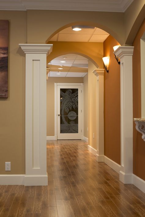 Rosie Aviles Orthodontics located in Palm City, Florida - Hallway www.kirchmanconstruction.com Pilasters Interior Design, Pillar Covering Ideas Indoor, Hallway Columns, Interior Column Design, Pilar Design, Interior Pillars, Column Decor, Arch Door, Elevated Homes