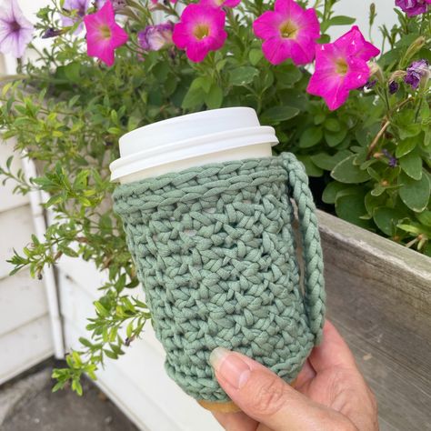 🎉Perk Up Cozy🎉 . It's pattern release day for the #perkupcozy ❤. Are you looking for a quick gift idea? Tired of burning your fingers on that quick cup of Joe? How about need something to soak up the moister from your iced beverage? This is the cozy for you. It is beginner friendly with instructions for this cute handle. . You can find this pattern 50% off in my Etsy and Ravelry shops through the weekend. I am also running a sale on the Brick & Mortar Cozy pattern. . Have you subscribed to my... Drink Cozies, Crochet Cup Cozy, Cozy Pattern, Coffee Cup Sleeves, Crochet Cozy, Cup Sleeve, Coffee Sleeve, Quick Gifts, Cup Cozy