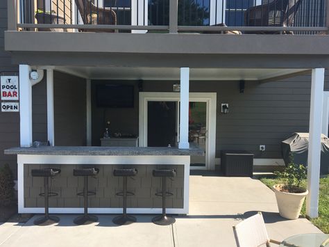 Built this bar under the deck and installed a underdeck roof. In the summers, this is our own Key West! Outdoor Bar Ideas Under Deck, Built In Deck Bar, Outdoor Bar Under Gazebo, Outdoor Bar Under Deck, Under Deck Bar Ideas, Under Deck Bar, Outdoor Kitchen Under Deck, Bar Under Deck, Deck With Bar