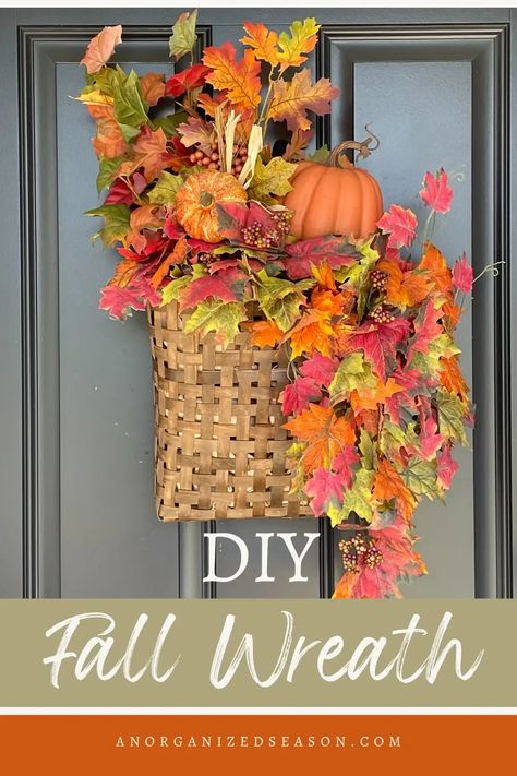 Basket wreath hanging on front door with fall leaves and orange pumpkins. Make A Fall Wreath, Inexpensive Wreaths, Fall Basket, Autumn Diy, Easy Fall Wreaths, Wreath Hanging, Basket Wreath, Decorated Wreaths, Faux Leaf