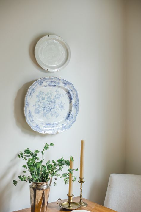 Pair of vintage plates on wall in historical cottage kitchen renovation. Blue and white plate paired with simple white ironstone plate. Studio Mcgee Plate Wall, Blue Plate Wall Display, Plates Hung On Walls, Ceramic Plate Wall Decor, Plate Wall Decor Kitchen, Vintage Wall Plates, Vintage Blue And White Kitchen, Kitchen Plate Display, Plate Hanging Ideas The Wall