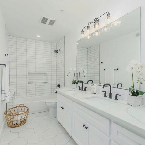 These Bathrooms Prove Hexagon Floor Tile Is Stunning Big White Subway Tile Bathroom, All Subway Tile Bathroom, Classic Bathroom Shower Tile, White Square Tile Shower Wall, Wall Tile Behind Vanity, White Bathroom Black Floor, White Bathroom Black Accents, Stacked White Subway Tile, Modern White Bathroom Design