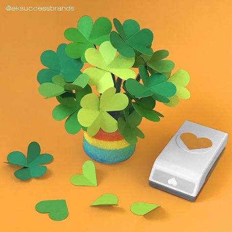 Are you ready for all things green and St. Patty's Day? Then show some love by crafting up some fun and easy shamrock bouquet centerpieces! Simply punch out 3 or 4 hearts shapes per shamrock using our EK Tools Heart Punch. Fold each heart in half and glue at the center using our EK Tools glue pen. Glue green pipe cleaner stems to each shamrock and display within a vase of your choice. Good LUCK and happy crafting!⁠ .⁠ .⁠ .⁠ #eksuccess # americancrafts #ektools #ekpunch #stpatricksday #shamrock Leaves Origami, Shamrock Bouquet, Hearts Shapes, Shamrock Craft, All Things Green, Scrapbooking Tools, Glue Pen, Handmade Paper Crafts, Handmade Flowers Paper