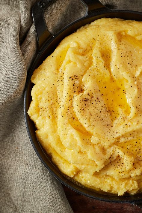 This rich and indulgent polenta recipe from the Aosta Valley is mountain cooking at its best. The polenta is mixed with butter, milk and the region's famous Fontina cheese, making it a perfect side dish to rich stews such as Carbonnade Valdostana. Polenta Dishes, Nye Dinner, Polenta Recipe, Sauce Bolognaise, Aosta Valley, Polenta Recipes, Traditional Italian Dishes, Fontina Cheese, Butter Milk