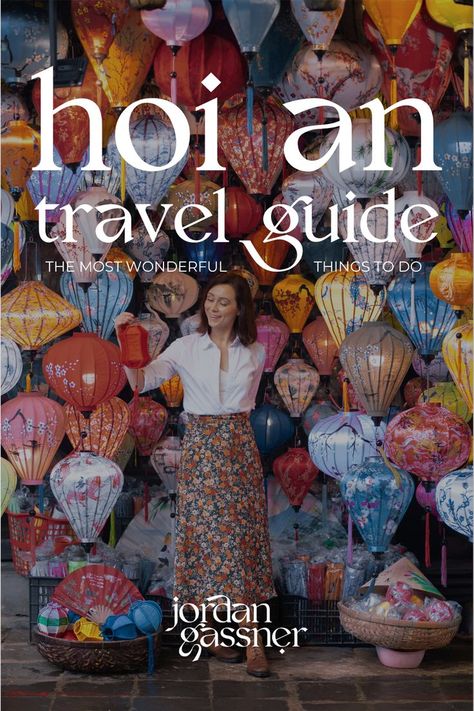 The text "Hoi An Travel Guide: The 15 Most Wonderful Things To Do" overlaying a photo of Travel Blogger Jordan Gassner smiling while looking at a red lantern in her hand and standing inside a small lantern shop in Hoi An, Vietnam Vietnam Aesthetic, Ba Na Hills, Vietnam Itinerary, Hoi An Vietnam, Travel Vietnam, Travel Budget, Southeast Asia Travel, Hoi An, Vietnam Travel