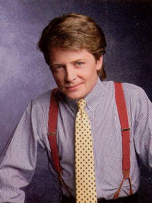 Michael J. Fox as Alex P. Keaton. Red braces, yellow tie and blue pinstripe shirt...This is definitely from the late 1980s Yuppies Fashion, 1980s Mens Fashion, Yuppie Style, Alex P Keaton, Graduating College, 80s Photos, 80’s Fashion, Alternative History, Michael J Fox