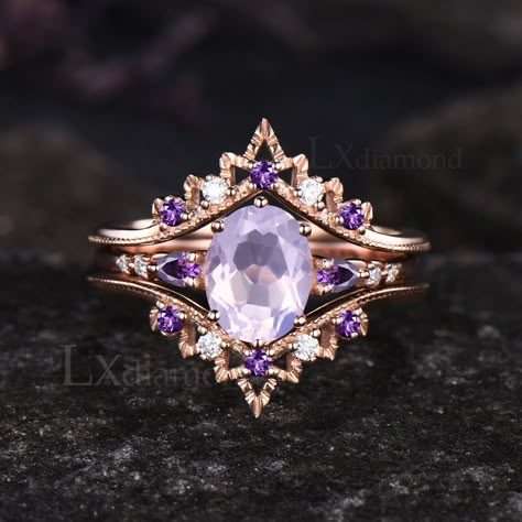 Item description ✦ Handmade, high-quality item! ✦ Material: 925 sterling silver, Solid 10k/14K/18K GOLD (can be made in white/rose/yellow gold) Engagement ring ✦ Center stone: Natural Lavender Amethyst. ✦ Size/Weight: 6x8mm Oval Cut ✦ Side stones: Pear Cut Natural Amethyst and Round Cut Moissanites Wedding band ✦ Gemstones: Round Cut Moissanites and Natural Amethyst Any ring size can be made,if the ring size is not in the option list ,contact me. As it is handmade,it needs 2-4 weeks to finish an Shiney Things, Amethyst Engagement Ring, Pretty Engagement Rings, Lavender Amethyst, Amethyst Ring Engagement, Cute Engagement Rings, Future Engagement Rings, Purple Rings, Dream Engagement Rings