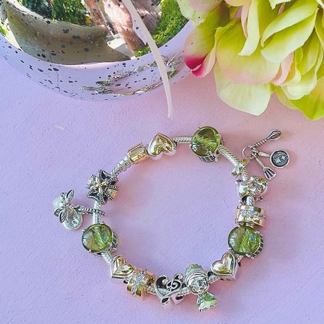 Today for #WorldPrincessWeek, it's all about Princess Tiana! The Princess and the Frog premiered in 2009 and TIana's signature color green is perfect for this month's birthstone. Tiana is ambitious, confident, driven and talented! 💚 Tell us below which word describes YOU the most! #PandoraLasVegas #PandoraJewelry #PandoraCharms #DisneyxPandora #PrincessTiana #ThePrincessandtheFrog #PandoraBracelets #AugustBirthstone #KissAFrog #DisneyPrincess Princess Tiana Pandora Charm, Tiana Pandora Bracelet, Tiana Pandora Charm, Princess Tiana Inspired Jewelry, The Princess And The Frog Jewelry, Princess And The Frog Charm Bracelet, Princess Tiana Necklace, Tiana Princess And The Frog Jewelry, Princess And The Frog Pandora Charm