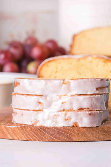 Pound cake is a timeless favorite, and this sour cream version is truly irresistible! With a hint of vanilla and the added appeal of sour cream, it stays so moist and offers a yummy tang. You’ll find this recipe super-simple to whip up. The loaf comes out soft and delicious, and to top it all off, there’s a sweet glaze that you can customize with your favorite flavors or colors if you like. Enjoying a slice of this scrumptious cake alongside your favorite coffee or tea is always such a treat. Sour Cream Pound Cake With Glaze, Vanilla Pound Cake Loaf, Vanilla Sour Cream Cake, Baking With Sour Cream, Sour Cream Cake Recipe, Cake Recipe With Sour Cream, Vanilla Loaf Cake, Sour Cream Desserts, Crumb Cakes