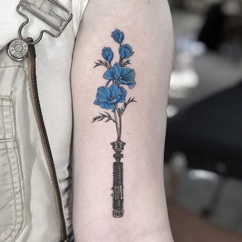 Star Wars Rib Tattoo, Starwars Lightsaber Tattoos, Anakin Obi Wan Tattoo, Flower Lightsaber Tattoo, Lightsaber With Flowers Tattoo, Star Wars Tiny Tattoo, Obi Wan Tattoo Ideas, Lightsaber Flower Tattoo, Obi Wan Kenobi Tattoo Ideas