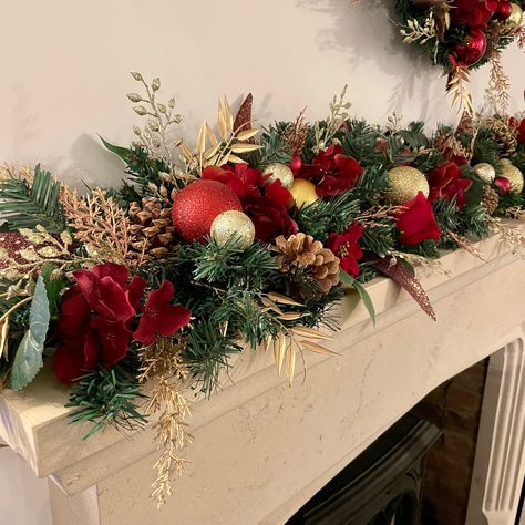 This luxurious garland with matching wreath looks simply stunning together!  6ft in length this is the perfect length for a fireplace.  Containing all the same elements as it’s matching wreath with large red tea roses, red peonies and hydrangeas, red and gold baubles, pinecones, and rose gold and gold varying leaf spra Christmas Decor Ideas Red Green And Gold, Mantlepiece Decor Christmas, Fireplace Wreath Christmas, Red And Copper Christmas Tree, Green Red And Gold Christmas Decor, Luxury Christmas Decor Outdoor, Christmas Decor Wreaths & Garlands, Red Green And Gold Christmas Decor, Christmas Decor Ideas Red And Green