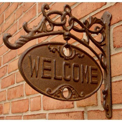 Red Barrel Studio® Welcome Go Away Sign Ornate Rustic Cast Iron Door Plaque is an antique reproduction cast iron sign with raised lettering and an antique brown finish that reads: WELCOME and when you spin it around the other side reads: GO AWAY Double-Sided Welcome Go Away Sign is made from cast iron with a rustic antique brown finish for indoor and outdoor use. Sign measures 12" Wide x 11" Tall, and is a hilarious way to let your guests know when you want to be left alone! | Red Barrel Studio® Vintage Outdoor Decor, Iron Front Door, Gate Signs, Cast Iron Door, Door Plaque, Funny Home Decor, Pub Decor, Antique Signs, Door Plaques