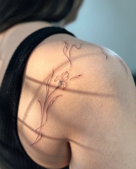 Loved this piece — would love to do more in future! Should we comment our fav flowers? I feel like most people say rose? mine are butterfly ranunculus, iris, and tulip 🌷 #finelinetattooartist #tampafineline #daintytattoos #tampagirls #minimalisttattoos Dainty fine line tattoo flower ideas for women in Tampa Florida Dainty Line Tattoos For Women, Iris Vine Tattoo, Iris Tattoo Arm, Gladiolus Tattoo Color, Iris Tattoo Fine Line, Lily And Tulip Tattoo, Back Flower Tattoo Women, Iris Back Tattoo, Tiny Tattoo Ideas With Meaning