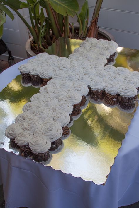 White Cupcakes in the shape of a cross cake.....54 cupcakes Baptismal Party, Baby Dedication Party, Confirmation Ideas, Cross Cake, Recuerdos Primera Comunion Ideas, Cross Cakes, Green Cupcakes, First Communion Cakes, Confirmation Cakes