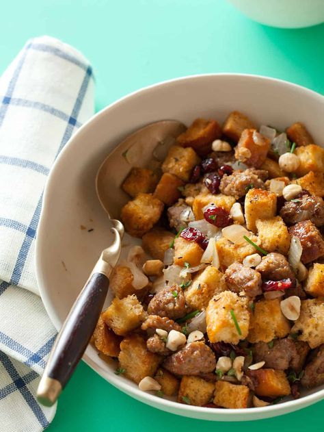 Sausage and Sage Stuffing with Dried Cranberries and Toasted Hazelnuts Sausage Sage Stuffing, Holiday Stuffing, Sage Stuffing, Hazelnut Recipes, Spoon Fork Bacon, Sage Sausage, Italian Sausage Recipes, Sweet Italian Sausage, Low Sodium Chicken Broth