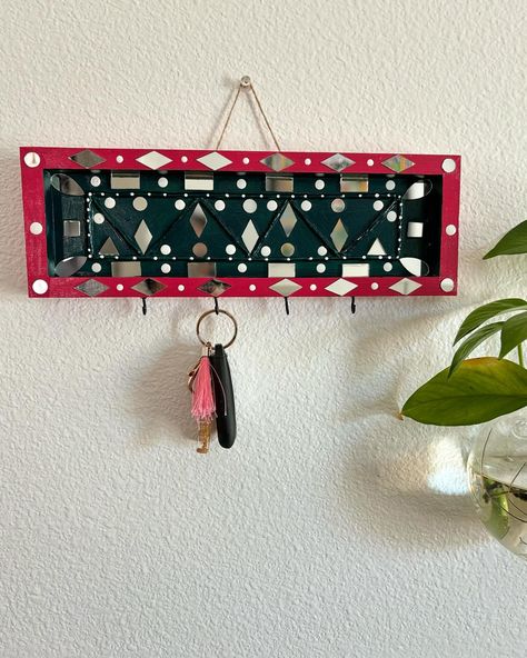 Available to buy Clay/Lippan art key holders . Wooden holder. Size 12 inches wide. 4 keys can be hanged . Perfect for gift purposes. Can customize according to orders. Asking price $17 Etsy.com/shop/pallavisplashart Local pickup is possible. DM to buy or msg at (804) 548-3336 #keyholders #keyholder #gift #handmade #homedecor #keychain #souvenirs #walldecor #decor #customized #keyholdercreations #personalizedkeyholder #cordholder #design #justlove Clay Lippan Art, Personalized Key Holder, Lippan Art, Cord Holder, Key Holders, Gift Handmade, Key Holder, Size 12, Key