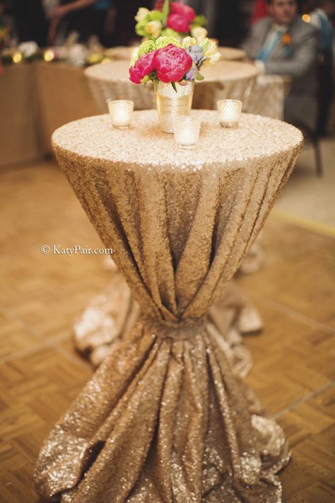 Sequin cocktail table linens with simple centerpiece. Sequin Cake Table, Cocktail Table Linens, Gold Table Centerpieces, Cocktail Table Centerpieces, Gold Table Decorations, Gold Cocktail Table, Sequin Cake, Gold Sequin Tablecloth, Christmas Gala