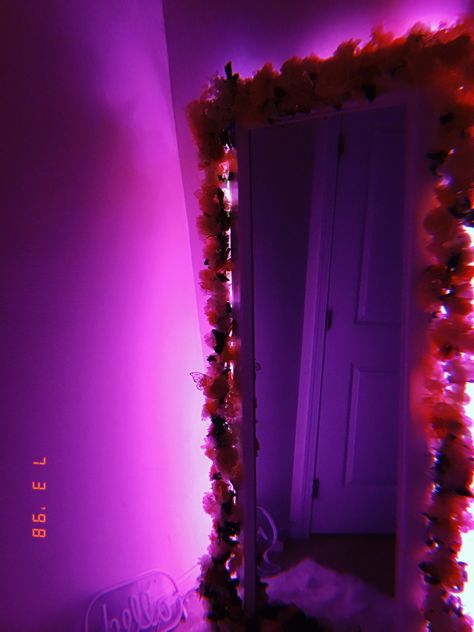 My sister made this which took time, she had to repaint the mirror white and she had some flowers from Amazon to put over it and a led light behind which made everything perfect. Led Light Behind Mirror, Led Behind Mirror, Cloud Mirror Led Lights, Led Lights Behind Mirror, Diy Led Mirror, Led Mirror Bedroom, Mirror Flower Decor, Big Mirror In Bedroom, Mirror Decorations