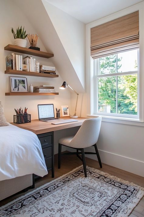 Cozy home office with a desk under a window, shelves with books and plants, and a patterned rug. Office In Corner Of Bedroom, Bedroom Inspirations With Desk, Guest Bedroom Ideas With Desk, Office In Small Bedroom, Small Spare Room Office, Small Bedroom With Office Space, Small Bedroom With Desk Layout, Small Spare Room Ideas Multi Purpose, Small Bedroom Office Layout