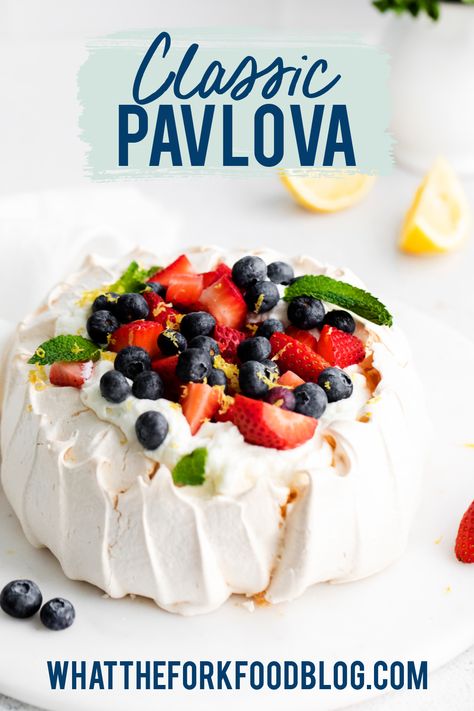 Learn how to make Pavlova with this simple Pavlova recipe. Pavlova is an easy dessert to make and calls for very few ingredients. If you’re looking for egg white recipes or a meringue recipe, this is all you need. This is a classic berry Pavlova with homemade whipped cream and fresh berries but fill it with lemon curd for a lemon version! Pavlova is a naturally gluten free dessert too! Recipe from @whattheforkblog - visit whattheforkfoodblog.com for more gluten free baking and dessert recipes. Classic Pavlova, Classic Pavlova Recipe, Berry Pavlova, White Recipes, What The Fork, Egg White Recipes, Baked Meringue, Meringue Desserts, Dessert To Make