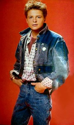 Breakdown of Marty's unique jean jacket on the Back to the Future wiki, at the link. Michael J Fox Young, Michael Fox, 80s Fashion Men, Unique Jeans, Blue Panels, Michael J Fox, Future Photos, J Fox, The Wedding Singer