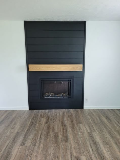 Shiplap Fireplace Over Brick, Wood Paneling Around Fireplace, Black Fireplace Wall Shiplap, Shiplap Fireplace Makeover, Diy Black Shiplap Fireplace, White Fireplace Dark Walls, Mantle Black Fireplace, Black Fireplace With Wood Mantle, Black Shiplap Fireplace With Wood Mantle