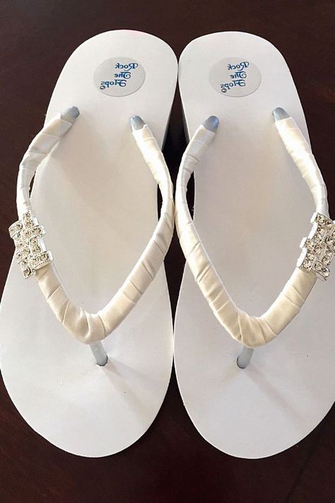 Those wedge bridal shoes could be ideal for the bride-to-be. If you're looking for a little extra height, these wedding shoes could be what you need. Keep these to your bridal board. Wedge Sandals Wedding, Rhinestone Wedges, Bridal Shoes Wedges, Beach Wedding Guest Book, Beach Wedding Groomsmen, Beach Wedding Suits, Beach Wedding Bridesmaid Dresses, Beach Wedding Outfit, Bridal Flip Flops