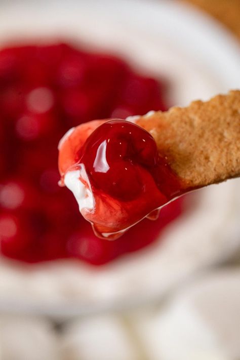 Cherry Cheesecake Dip is the perfect blend of appetizer and dessert dip, with cream cheese, powdered sugar, and cherry pie filling. Cherry Cheesecake Dip Recipe, Cherry Cheesecake Dip, Cheesecake Dip Recipe, No Bake Cherry Cheesecake, Dessert Dip, Cream Cheese Dip, Cheesecake Dip, Finger Foods Easy, Cherry Cheesecake