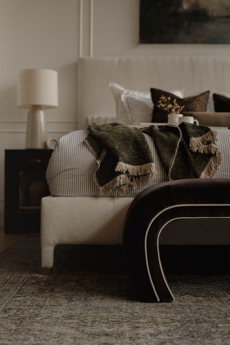 From the rich cocoa velvet of the O'Neal Bench to the textured cream bouclé of the Mia Bed, every detail of this primary bedroom was hand-selected to inspire rest and relaxation. The one-of-a-kind Simona Rug highlights the blue tones seen in the artwork for an atmosphere of calm. The perfect place to recharge at the end of the day. Design: Stephenson House 📷️: Marielle Elizabeth Bench At End Of King Bed, Mia Bed, Marielle Elizabeth, Brass Accent Table, Bedroom Furnishings, Primary Bedroom, Rest And Relaxation, Brass Table, King Bed