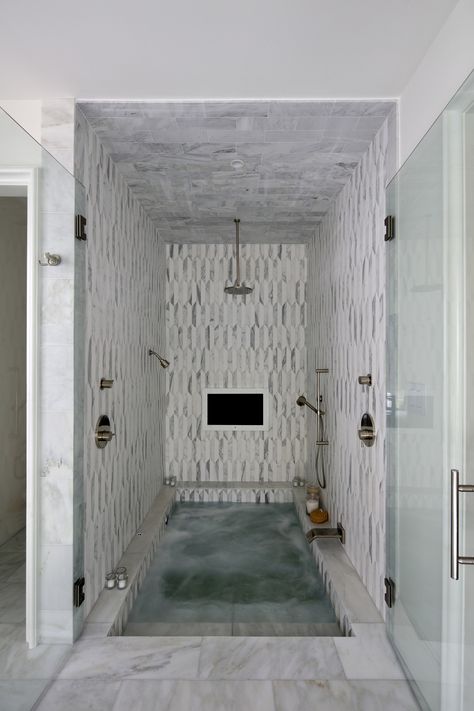 Grey and white marble tile, walk-in jetted tub, multiple shower heads, recessed lighting, candles and a TV — what more could you want in a luxurious bathing experience! Image: Chris Luker Spa Room Ideas, Sunken Bathtub, Sunken Tub, White Marble Floor, Spa Rooms, Spa Shower, Bad Inspiration, Bathroom Tub, Tub Shower Combo