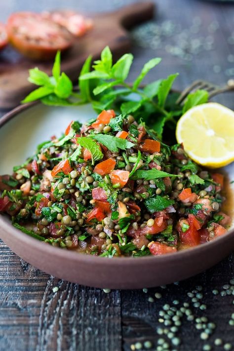 This Simple Lentil Tabouli Salad is full of Middle Eastern flavor! Filling lentils are paired with summer tomatoes, lemon, mint and parsley and a unique combination of spices, and keeps for several days, perfect for midweek lunches or potlucks! Vegan and Gluten-Free #tabouli #lentil #lentils #lentilsalad #lentiltabouli #lentiltabbouleh #tabbouleh #vegan #salad #glutenfree Tabouli Salad Recipe, Arabisk Mad, Tabouli Salad, Hearty Salads, Lentil Salad, Lentil Recipes, Lemon Mint, Vegan Salad, Middle Eastern Recipes