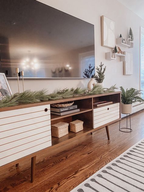 Living Room Designs With Tv Stand, Styling A Tv Stand Living Rooms, Picture Frames On Tv Stand, Styling Tv Stand Living Rooms, Long Tv Stand Decor, Holiday Tv Stand Decor, Winter Tv Stand Decor, Christmas Decor Ideas Tv Console, Boho Living Room Tv Stands