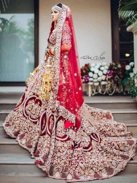 Looking for Long trail Bridal Lehengas ? Check out more such bridal fashion inspiration on the blog. Click on the link attached below.    #indianweddings #shaadisaga #intimateweddings #bridalfashion #bridallehenga #longtraillehenga #indianweddingtrends #extraordinarylehenga #indianbridaltrends #elegantlehenga शादी की तस्वीरें, Lehenga Bridal, Bride Photos Poses, Red Bridal Dress, Bridal Dupatta, Bridal Photography Poses, Indian Bridal Photos, Wedding Lehenga Designs, Bridal Lehenga Collection