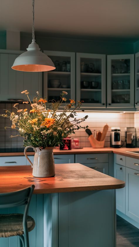 Elevate your kitchen aesthetic with a delightful display of wildflowers in a ceramic jug, perfectly styled with IKEA's KUNGSBACKA cabinet and SINNERLIG pendant lamp. The FINTORP rail adds a touch of personality, while the under-cabinet lighting creates a warm and inviting workspace. Discover how to infuse nature into your home decor and create a welcoming atmosphere for family and friends. Click to explore more styling tips! #IKEAStyle #WildflowerDecor #KitchenInspo Sinnerlig Pendant, Sink Lighting, Kitchen Sink Lighting, Ikea Style, Wildflower Decor, Charming Kitchen, Kitchen Aesthetic, Ceramic Jug, Under Cabinet Lighting