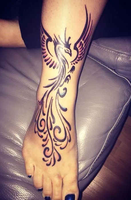 Mythological Phoenix Tattoo Meaning - TattoosWin Phoenix Foot Tattoo, Tattoo Japonais, Dr Tattoo, Phoenix Tattoo Feminine, Ring Finger Tattoos, Phoenix Tattoo Design, Inspiration Tattoos, Tattoos Skull, Bird Tattoo