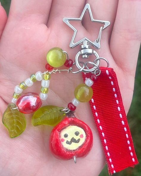 Apple dude 🍎 (available) ⟡DM to purchase ⟡ $8 + $4 U.S. Shipping All glass beads, red ribbon, and handmade clay charm :) . . . . . . . . . . #keychain #keychains #fruitcharms #claycharms #beads #jewelery #bracelets #beadedbracelets #charmbracelets #accessories #pursecharm #phonecharm #bagcharm #cutekeychain Apple Bracelet, Charm Keychain, Cute Keychain, Diy Keychain, Beaded Keychains, Handmade Clay, Clay Charms, Purse Charms, Diy Clay