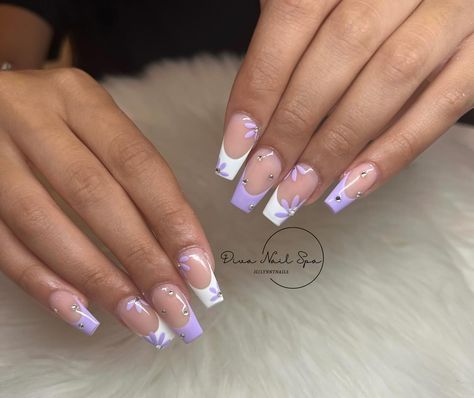 Purple Spring🪻 • • • • #nails #nailaddict #naildesign #nailart #nailsnailsnails #raleighnails #raleighnailtech #durhamnails #rdunails #nails2inspire #nails4today #swarovskicrystals #carynails #trendynails #followforfollowback #likesforlike #marchnails #coffinnails #chromenails #frenchnails #acrylic #acrylicnails #auranails #springnails #trendy #purplenails #manicure #trendy #whitenails #explorepage #flowernails Lilac And White Nails, Lavender And Silver Nails, Lavender And White Nails, Purple And White Nails, Purple Spring Nails, Lilac Nails Design, Lavender Quinceanera Dresses, Lavender Quinceanera, Purple Spring