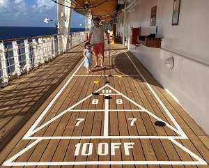 Deck Shuffleboard Rules: How to Play Shuffleboard Game Shuffleboard Rules, Retired Lifestyle, Deck Shuffleboard, Outdoor Shuffleboard, Shuffle Board, Senior Exercises, Coastal Exterior, Diy Yard Games, Play Outdoor