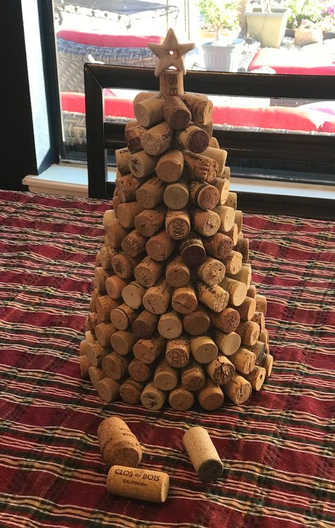 "Wine Cork tree from over 200 wine corks on a cardboard base with a recycled ceramic jewelry star.  12\" high with 7\" base.  great centerpiece for entertaining. Prefect for your oenophile (wine lover) friends and family." Cork Christmas Tree Diy, Christmas Decorations Made From Wine Corks, Wine Cork Xmas Tree, Wine Cork Xmas Tree Diy Christmas, Crochet Christmas Tree Wine Cork, Wine Cork Christmas Trees, Cork Decorations, Wine Cork Table, Wine Cork Diy Projects