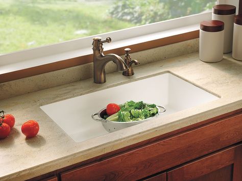 A single basin, the bigger the better, but no deeper than 10 inches or you'll be up to your elbows in suds all the time and leaning in too far. Choose one with a flat bottom, to keep glasses from tipping, and a drain placed toward the back of the basin so that it won't get stoppered by a stack of dirty dishes. Corian Kitchen Countertops, Kitchen Countertops Ideas, Old Kitchen Remodel, Countertop Concrete, Integrated Kitchen, Countertops Ideas, Single Basin Kitchen Sink, Corian Countertops, Galley Kitchen Remodel